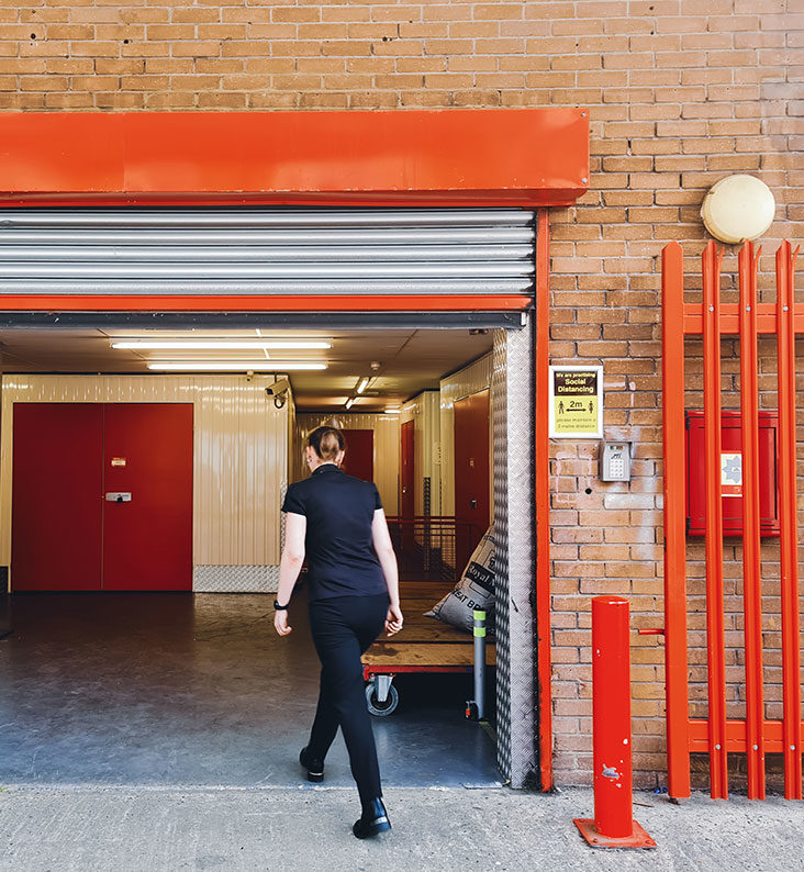 A woman is walking through the open loading bay at our Richmond branch.