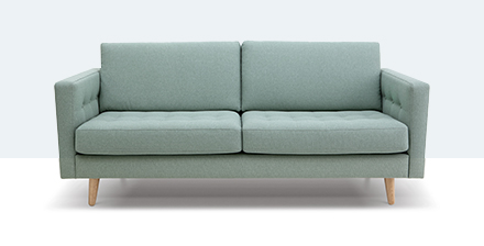 The front view of a pale green sofa.