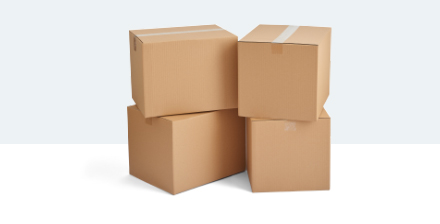 Four cardboard packing boxes are stacked side by side.