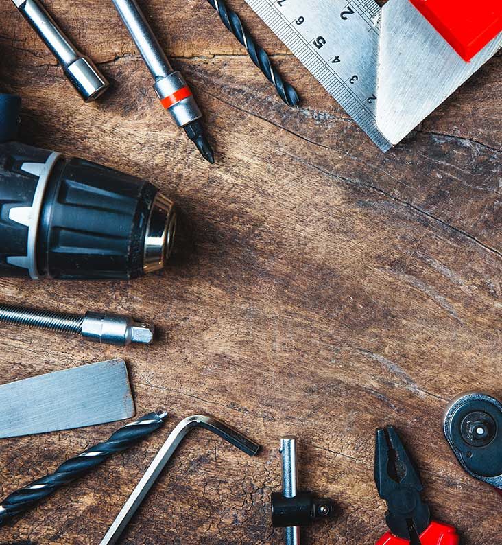 A collection of different tools such as drill bits, pliers and an allen key.
