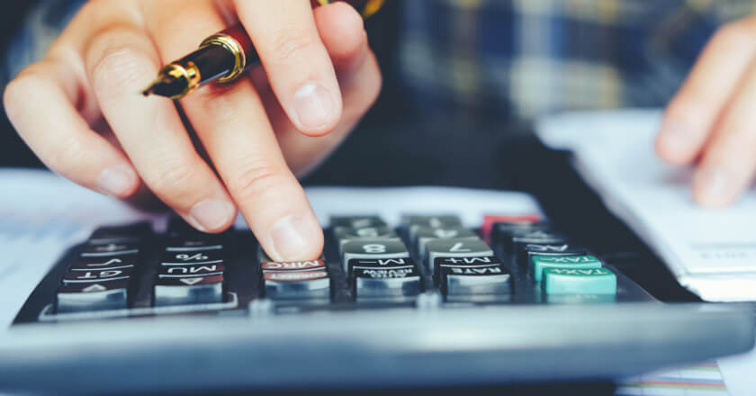 A person using a calculator. 