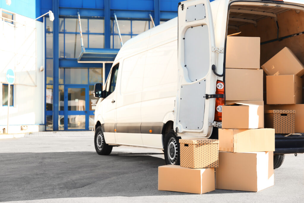 An image of a moving van filled with boxes.